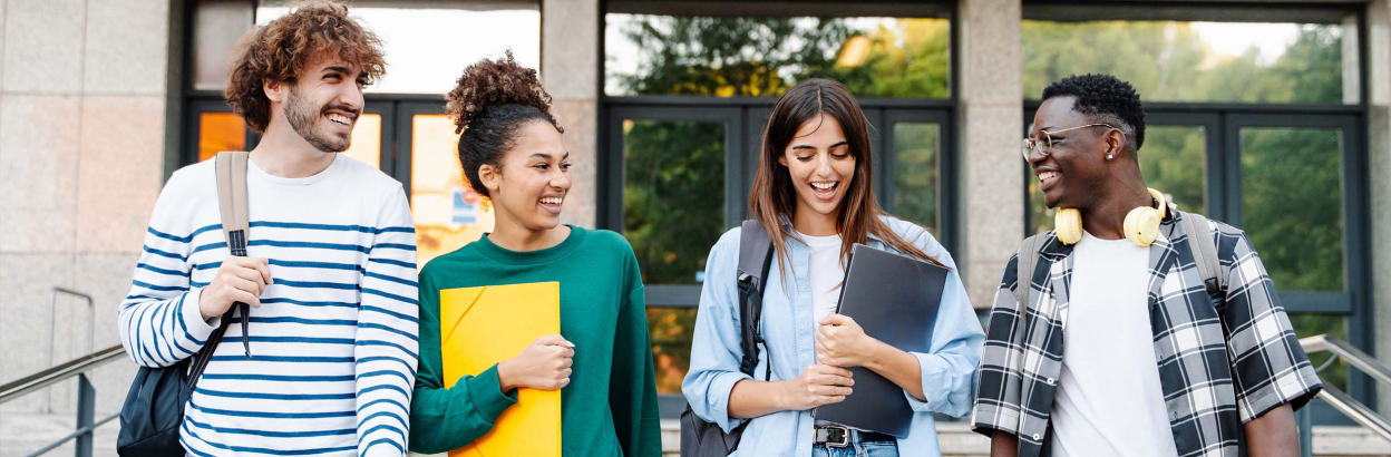 students in front of college building