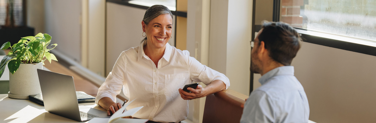 Businesswoman having a conversation with a colleague