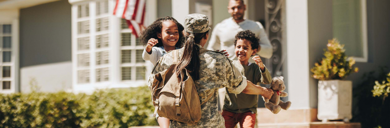 A military mom going to hug her children